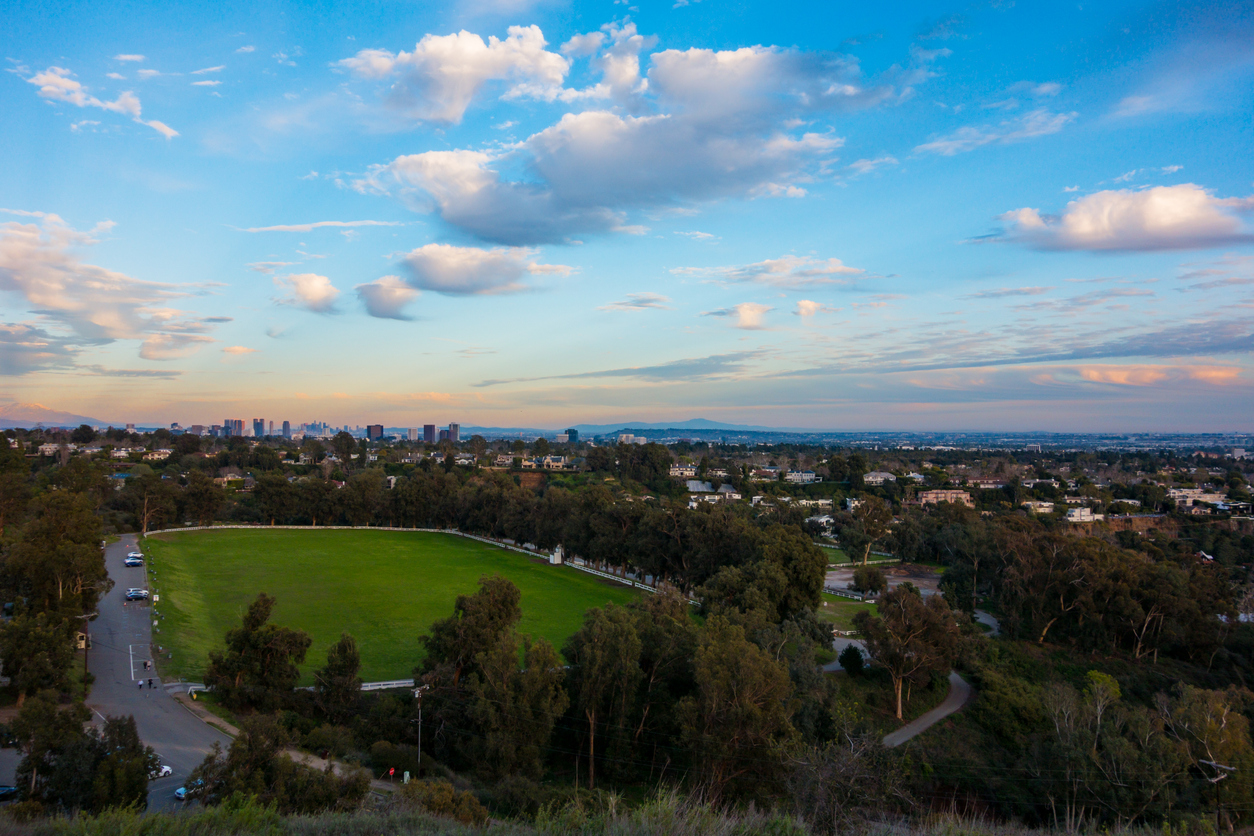 A photograph overlooking Will Rogers State Historic Park with LA skyline in the background.